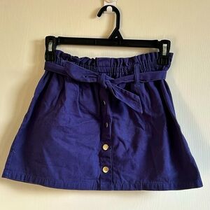 Cute blueish purple skirt with a tying options in the front!